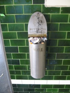 ButtOut Ashtray - clogged with trash and papers... ButtOut Ashtray - clogged with trash and papers...